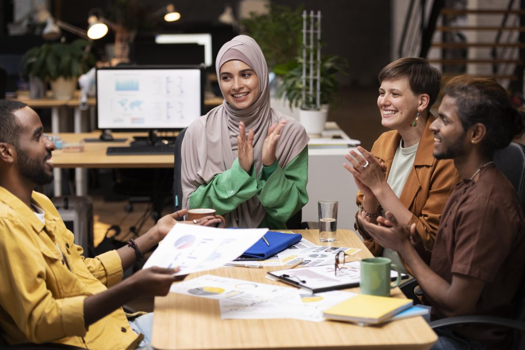 close up happy colleagues applauding
